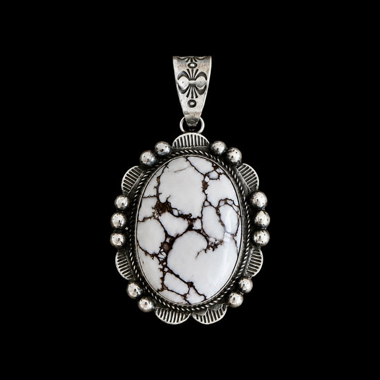 Necklace with a wild horse stone pendant on a black background by Donovan Nez
