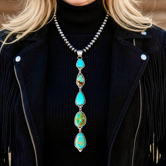 Kingman, Royston & Tyrone Turquoise pendant handcrafted by Native American artist Lorenzo and Jerilyn Chee