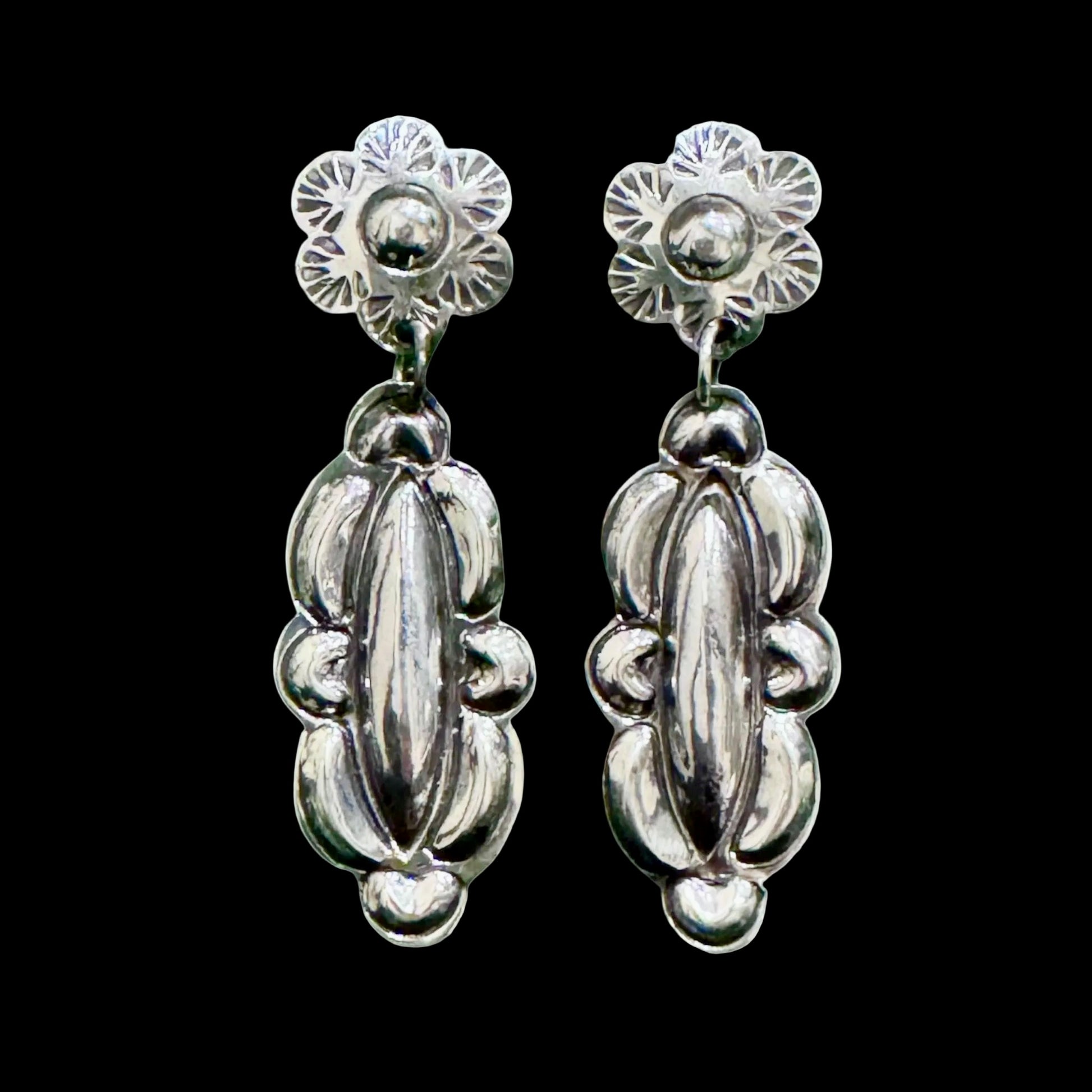 Sterling Silver Repoussé earrings handcrafted by Native American artist Tim Yazzie