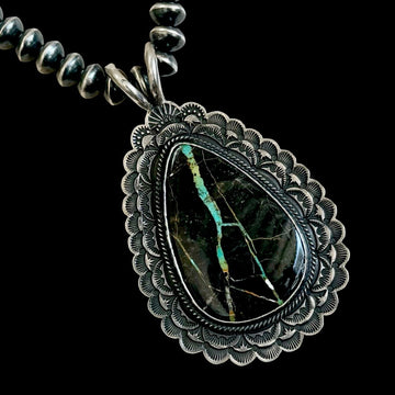 Blackjack Turquoise pendant handcrafted by Native American artist Sunshine Reeves