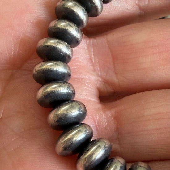 Sterling Silver stretch bracelet handcrafted by non-native artisan