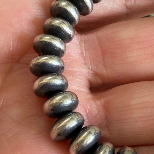 Sterling Silver stretch bracelet handcrafted by non-native artisan