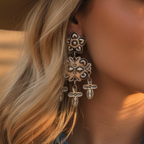 Sterling Silver Repoussé earrings handcrafted by Native American artist Tim Yazzie