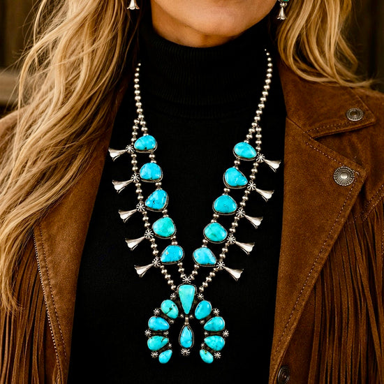 Natural Fox Turquoise squash blossom handcrafted by Native American artist Darrin Livingston