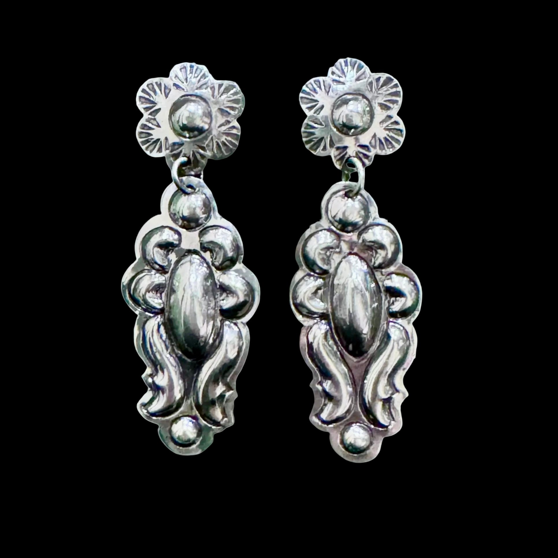 Sterling Silver Repoussé earrings handcrafted by Native American artist Tim Yazzie