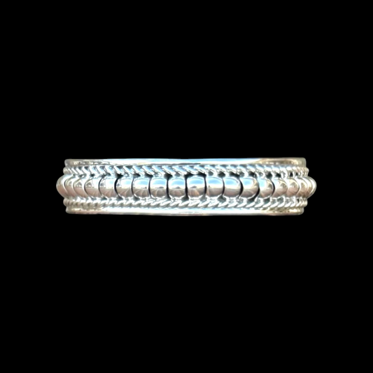 Rolled Sterling Silver cuff handcrafted by Native American artist Manvel Johnson