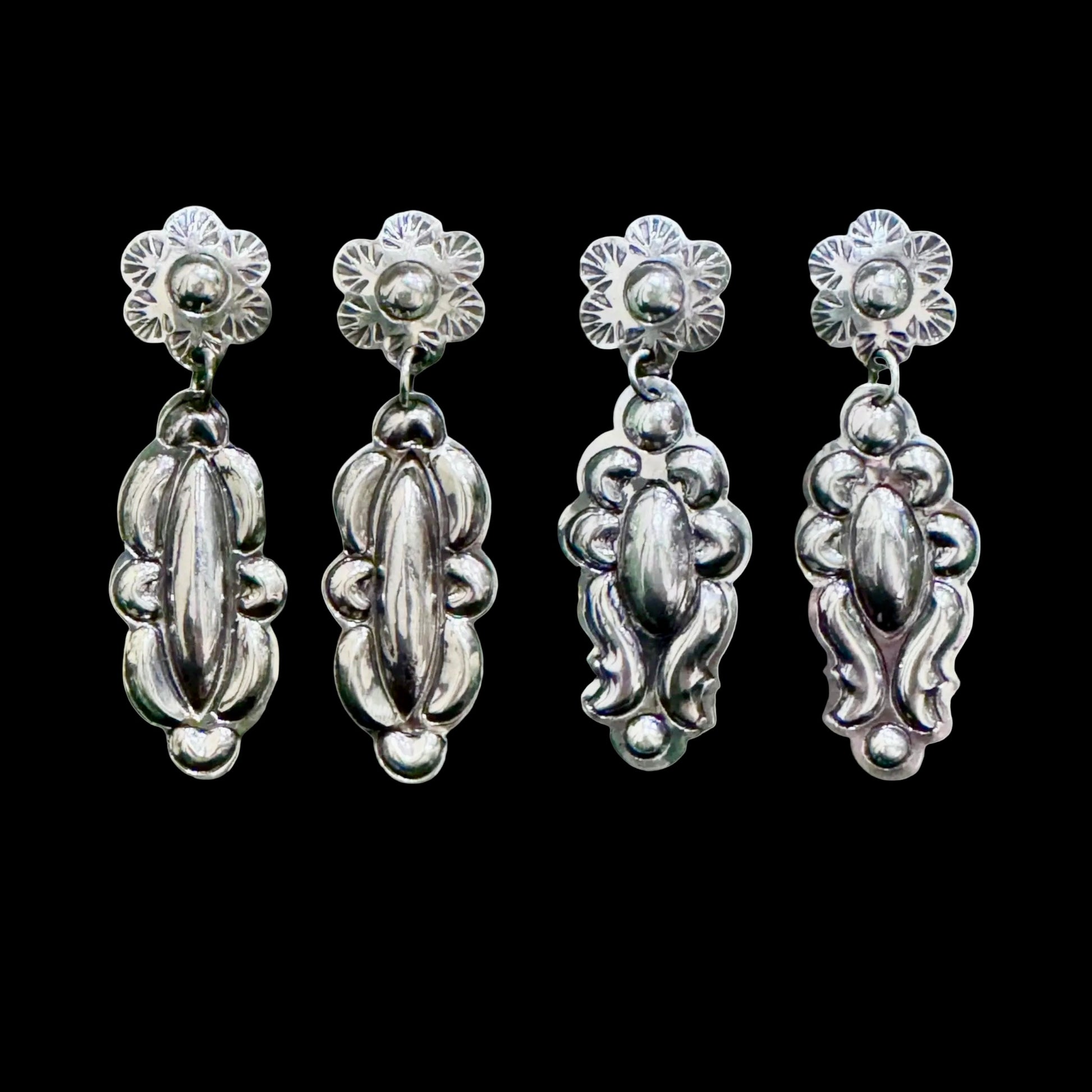 Sterling Silver Repoussé earrings handcrafted by Native American artist Tim Yazzie
