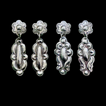 Sterling Silver Repoussé earrings handcrafted by Native American artist Tim Yazzie