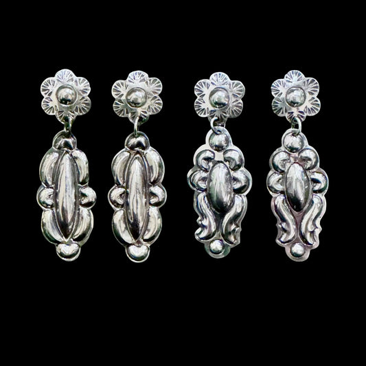 Sterling Silver Repoussé earrings handcrafted by Native American artist Tim Yazzie