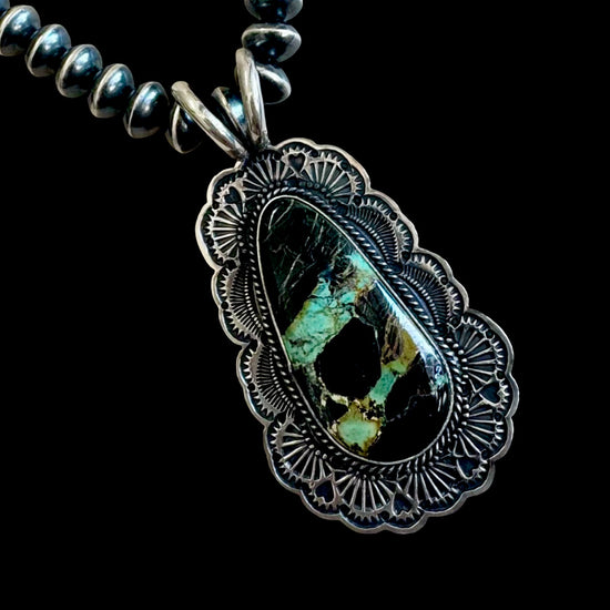 Blackjack Turquoise pendant handcrafted by Native American artist Sunshine Reeves