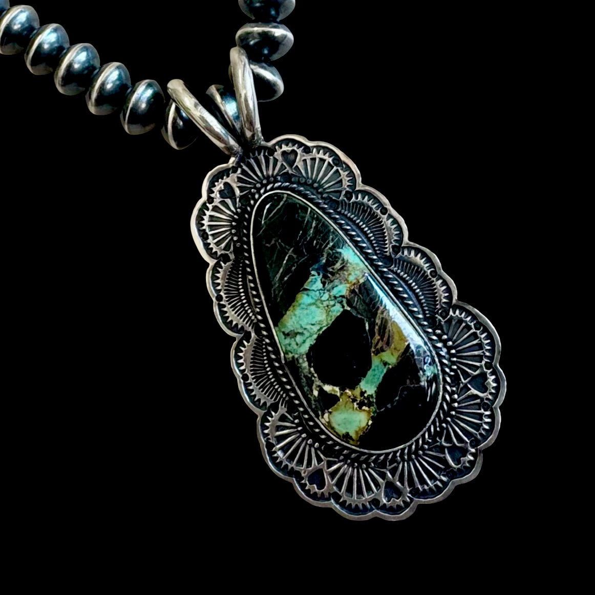 Blackjack Turquoise pendant handcrafted by Native American artist Sunshine Reeves