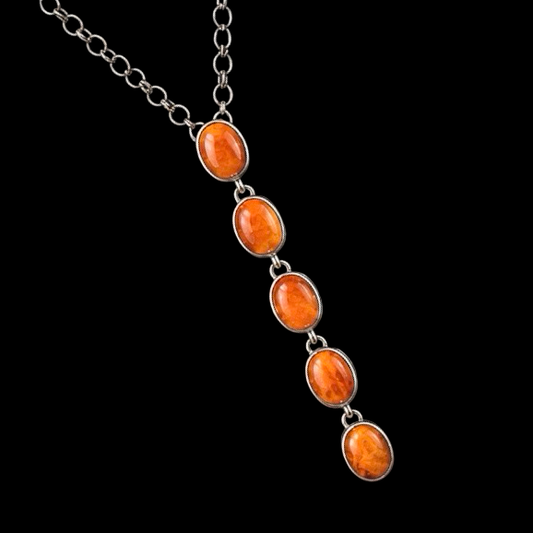 Orange Spiny Oyster lariat handcrafted by Native American artist Delaine & Dwayne Nez