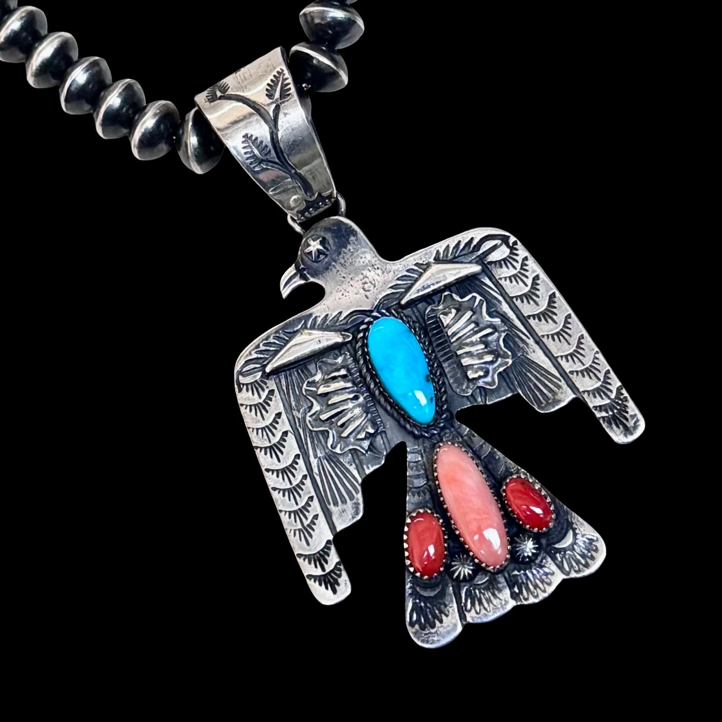 Multi-stone pendant handcrafted by Native American artist Richard Yazzie
