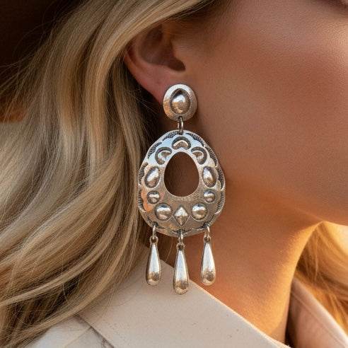 Sterling Silver Repoussé earrings handcrafted by Native American artist Tim Yazzie