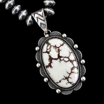 Necklace with a wild horse stone pendant on a black background by Donovan Nez