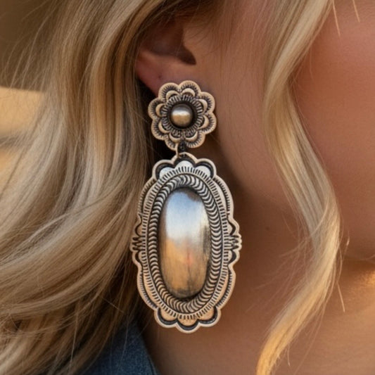 Sterling Silver Repoussé earrings handcrafted by Native American artist Leander Tahe