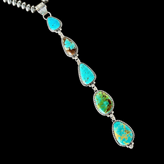 Kingman, Royston & Tyrone Turquoise pendant handcrafted by Native American artist Lorenzo and Jerilyn Chee
