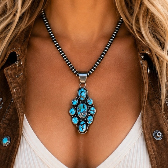 Golden Hills Turquoise pendant handcrafted by Native American artist Travis Jim