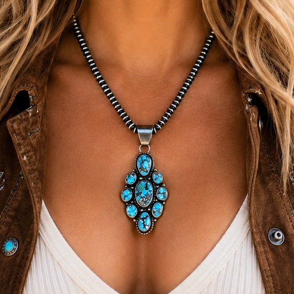 Golden Hills Turquoise pendant handcrafted by Native American artist Travis Jim