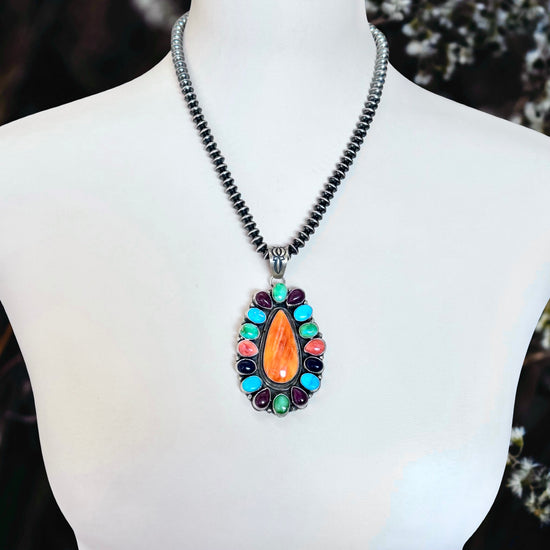 Multi-stone pendant handcrafted by Native American artist Ella Peters