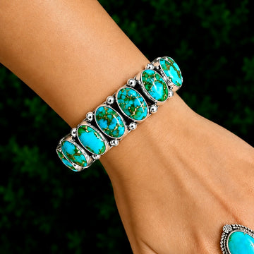 9 Stone Natural Sonoran Gold Turquoise cuff handcrafted by Native American artist Albert Jake (Heavy by Hand)