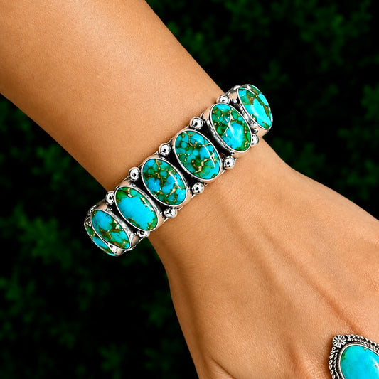 9 Stone Natural Sonoran Gold Turquoise cuff handcrafted by Native American artist Albert Jake (Heavy by Hand)