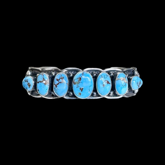 7 Stone Natural Golden Hills Turquoise cuff handcrafted by Native American artist Jereme Delgarito