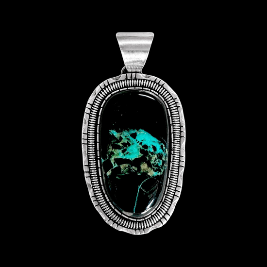 Blackjack Turquoise pendant handcrafted by Native American artist Walter Vandever