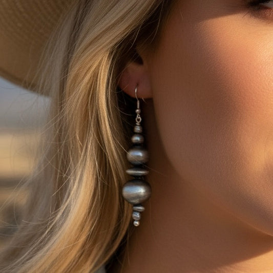 Sterling Silver earrings handcrafted by Native American artist Dorinda Mariano