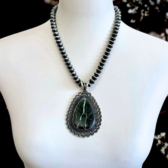 Blackjack Turquoise pendant handcrafted by Native American artist Sunshine Reeves