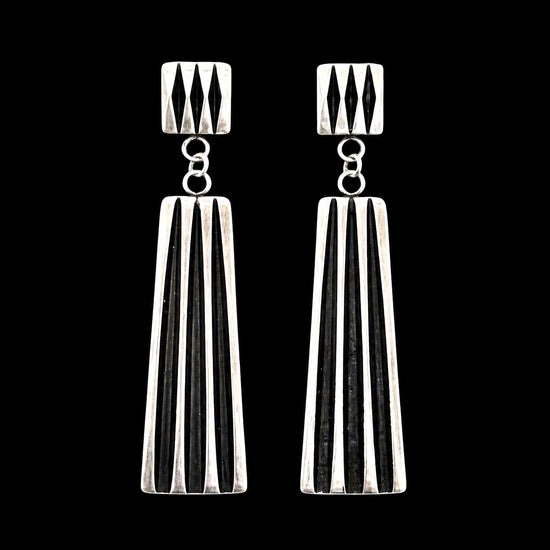 Sterling Silver earrings handcrafted by Native American artist Leander Tahe