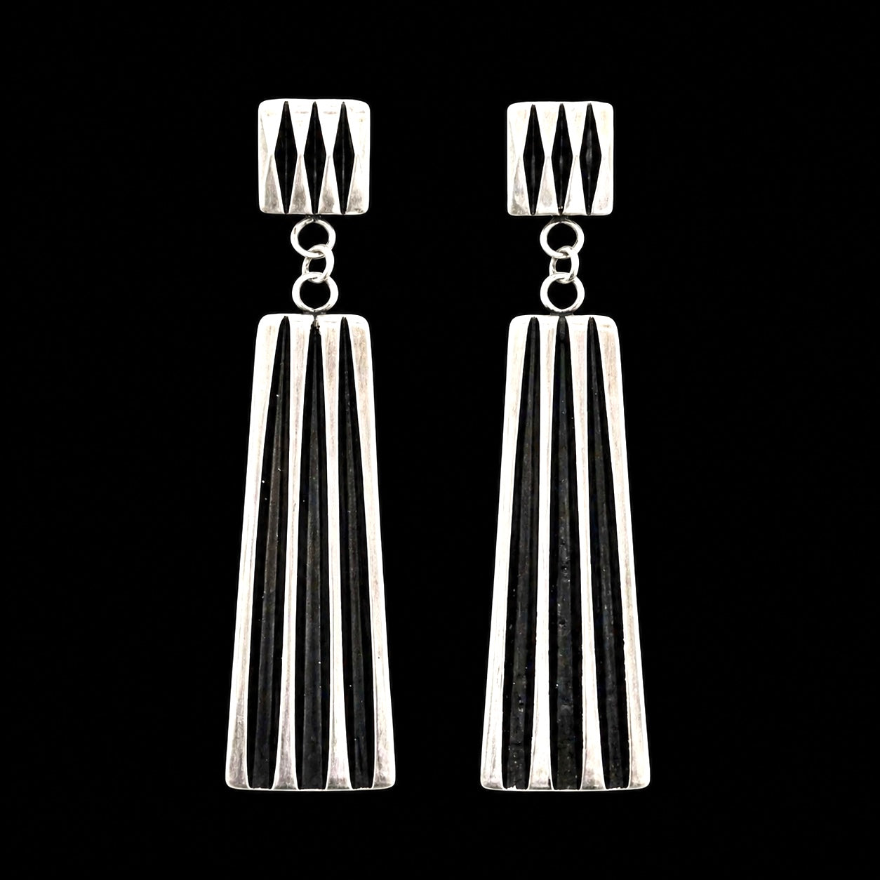 Sterling Silver earrings handcrafted by Native American artist Leander Tahe