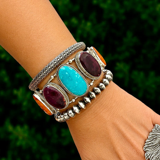 Orange, Purple Spiny with Kingman bracelet handcrafted by Native American artist Junior Begay
