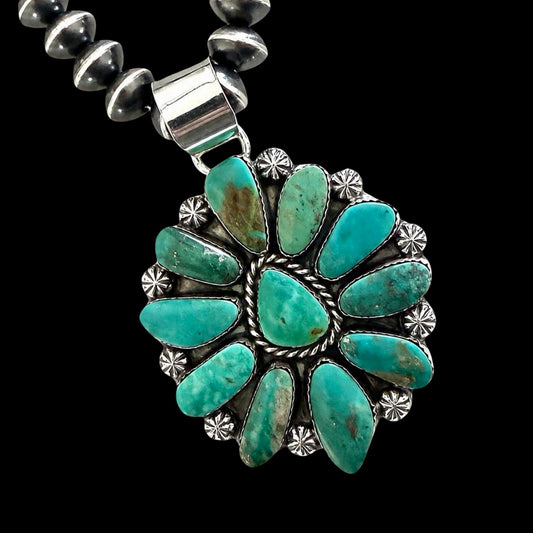 Turquoise cluster  necklace with silver clasp on a black background by Lorenzo and Jerilyn Chee