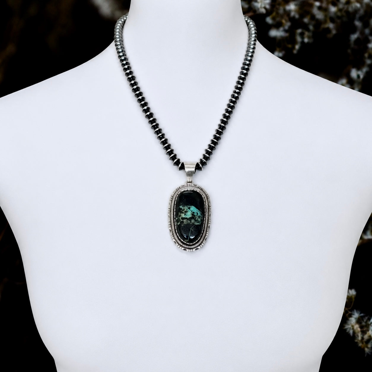 Blackjack Turquoise pendant handcrafted by Native American artist Walter Vandever