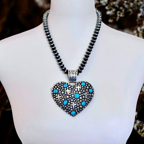 Sleeping Beauty Turquoise pendant handcrafted by Native American artist Akee Douglas