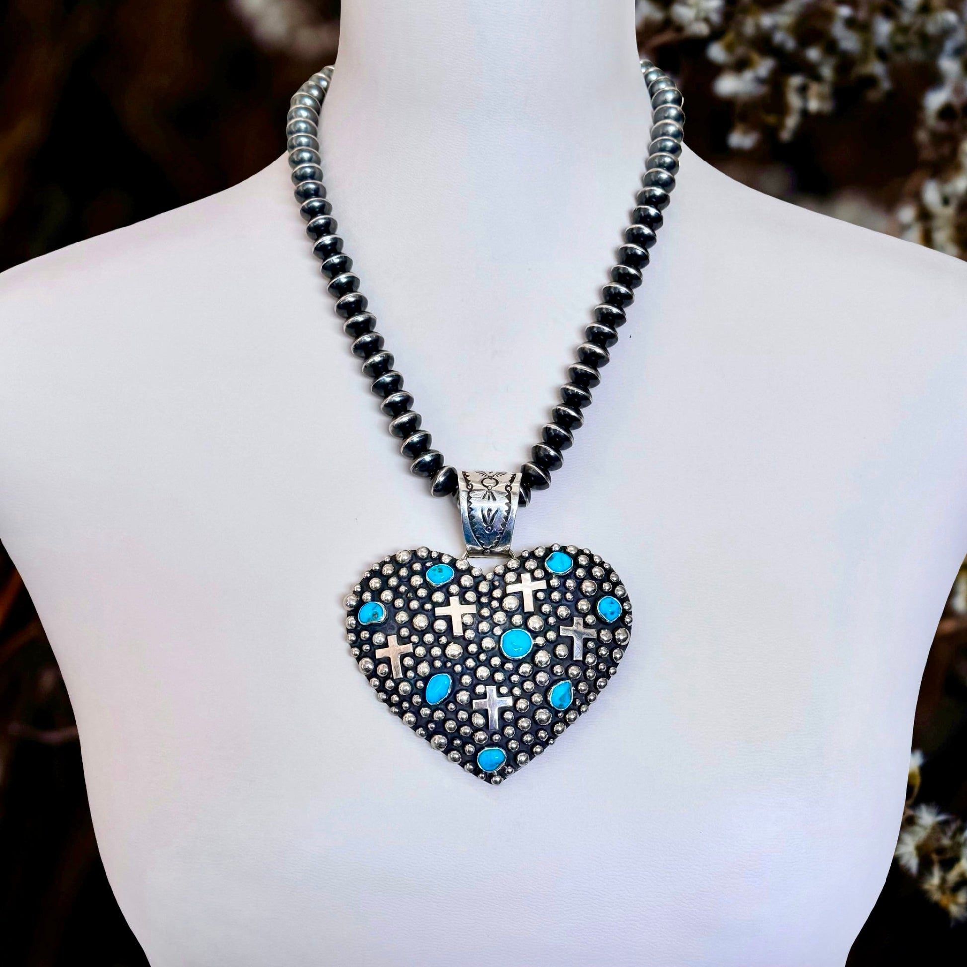 Sleeping Beauty Turquoise pendant handcrafted by Native American artist Akee Douglas