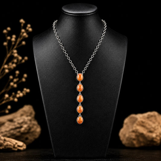 Orange Spiny Oyster lariat handcrafted by Native American artist Delaine & Dwayne Nez