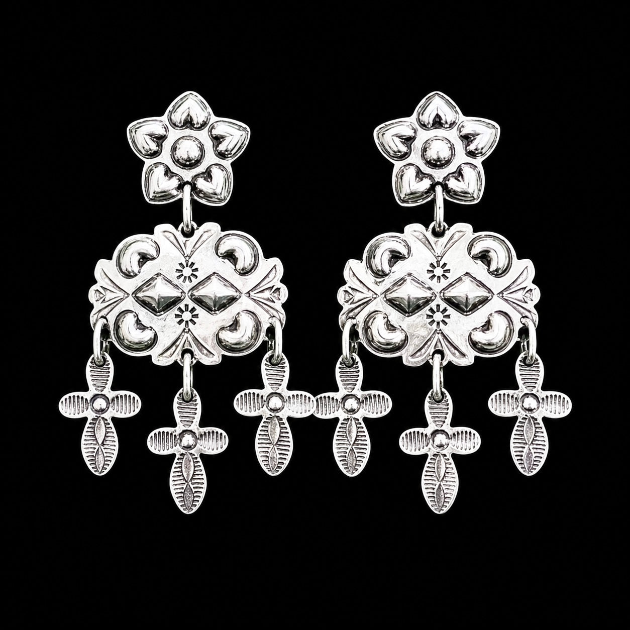 Sterling Silver Repoussé earrings handcrafted by Native American artist Tim Yazzie