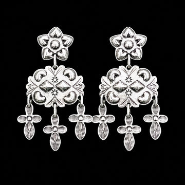Sterling Silver Repoussé earrings handcrafted by Native American artist Tim Yazzie
