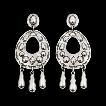 Sterling Silver Repoussé earrings handcrafted by Native American artist Tim Yazzie