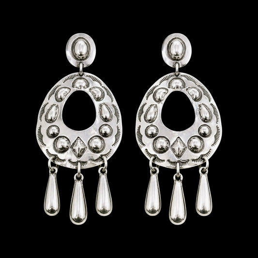 Sterling Silver Repoussé earrings handcrafted by Native American artist Tim Yazzie