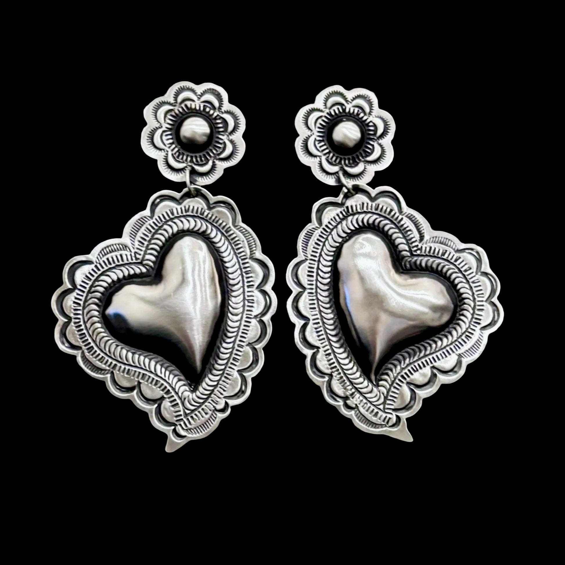 Sterling Silver Repoussé earrings handcrafted by Native American artist Leander Tahe