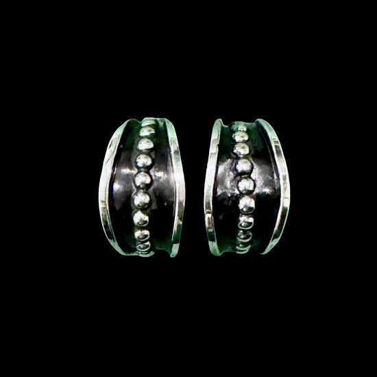 Sterling Silver earrings handcrafted by Native American artist Tom Hawk