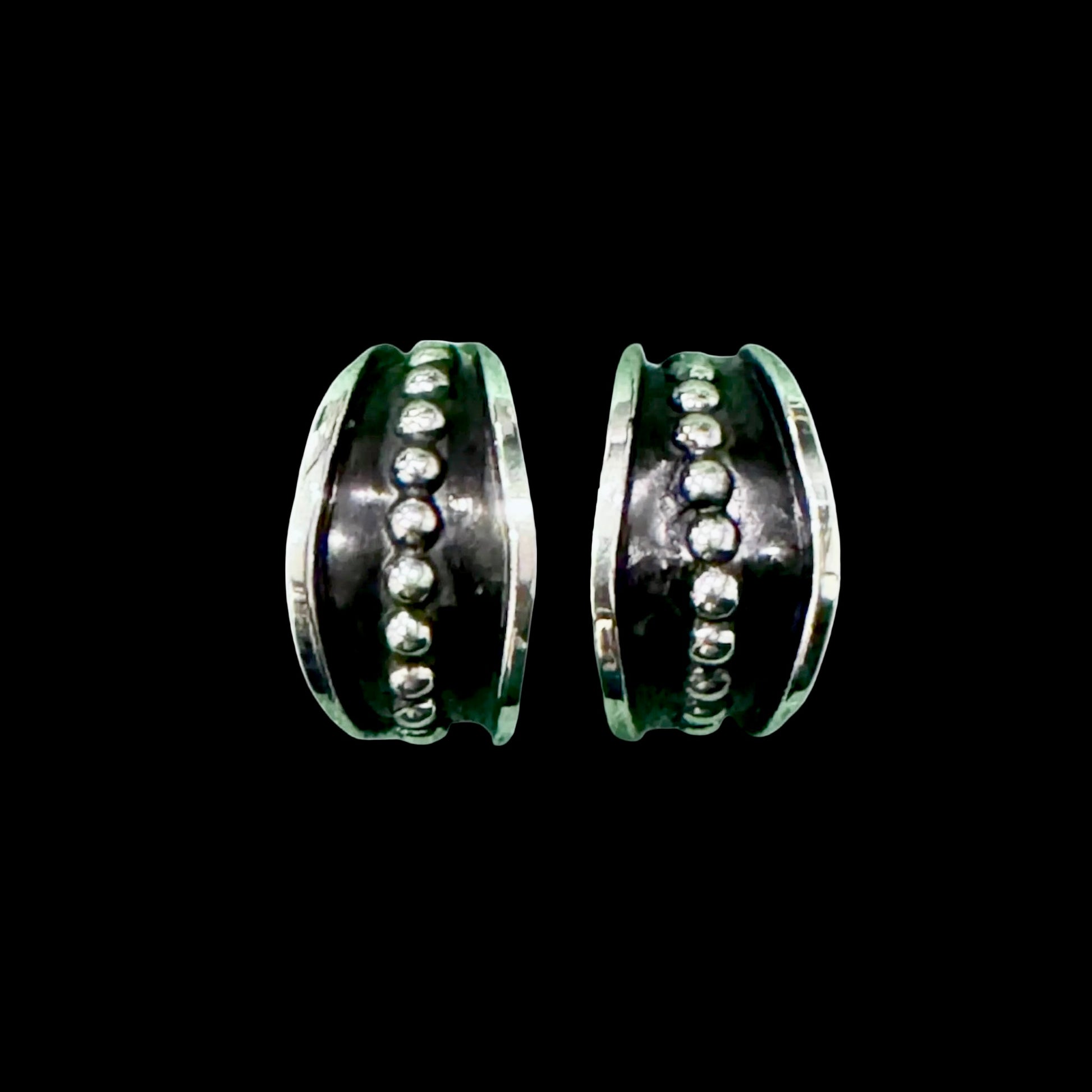 Sterling Silver earrings handcrafted by Native American artist Tom Hawk