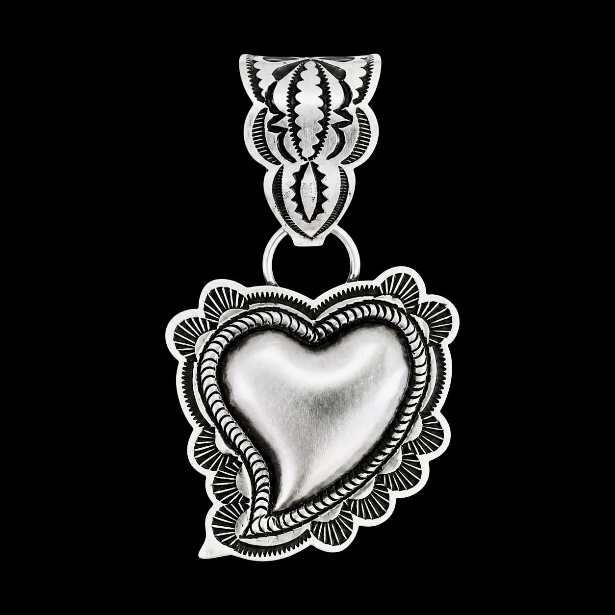 Sterling Silver pendant handcrafted by Native American artist Leander Tahe