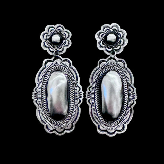Sterling Silver Repoussé earrings handcrafted by Native American artist Leander Tahe