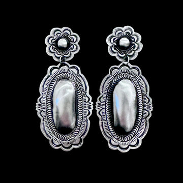 Sterling Silver Repoussé earrings handcrafted by Native American artist Leander Tahe