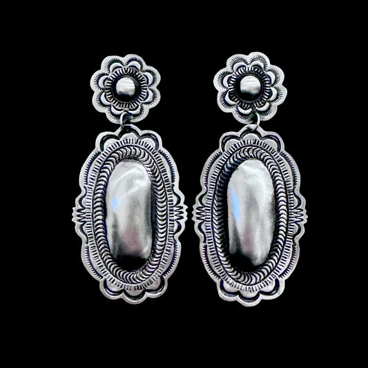 Sterling Silver Repoussé earrings handcrafted by Native American artist Leander Tahe