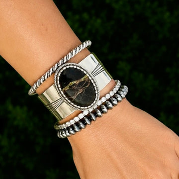 Blackjack Turquoise cuff handcrafted by Native American artist Leonard Nez